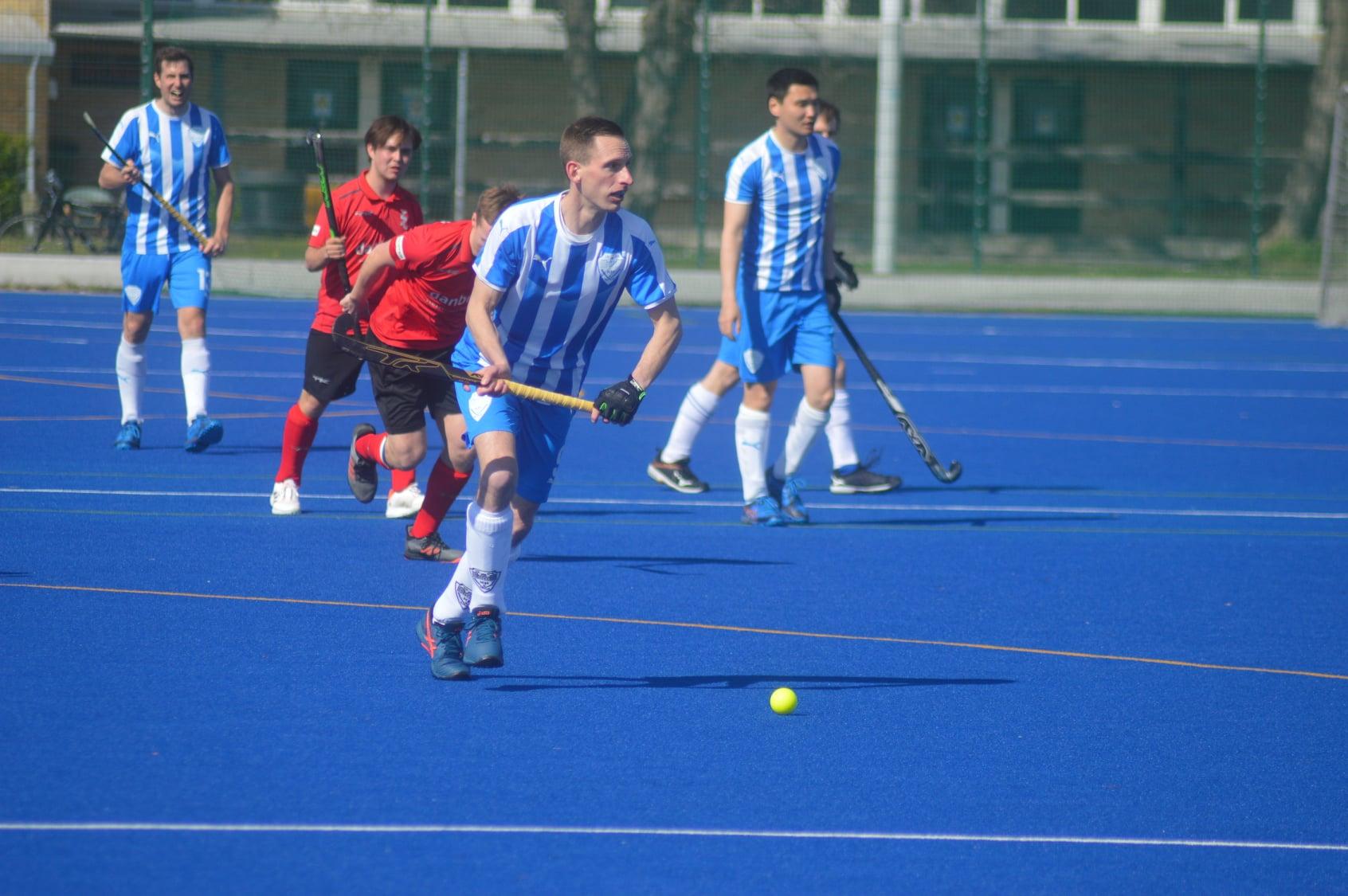 JJ playing outdoor hockey